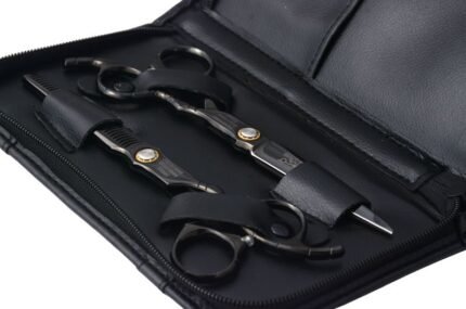 Hair cutting and thinning scissor pair with gold tension screw in black leather case